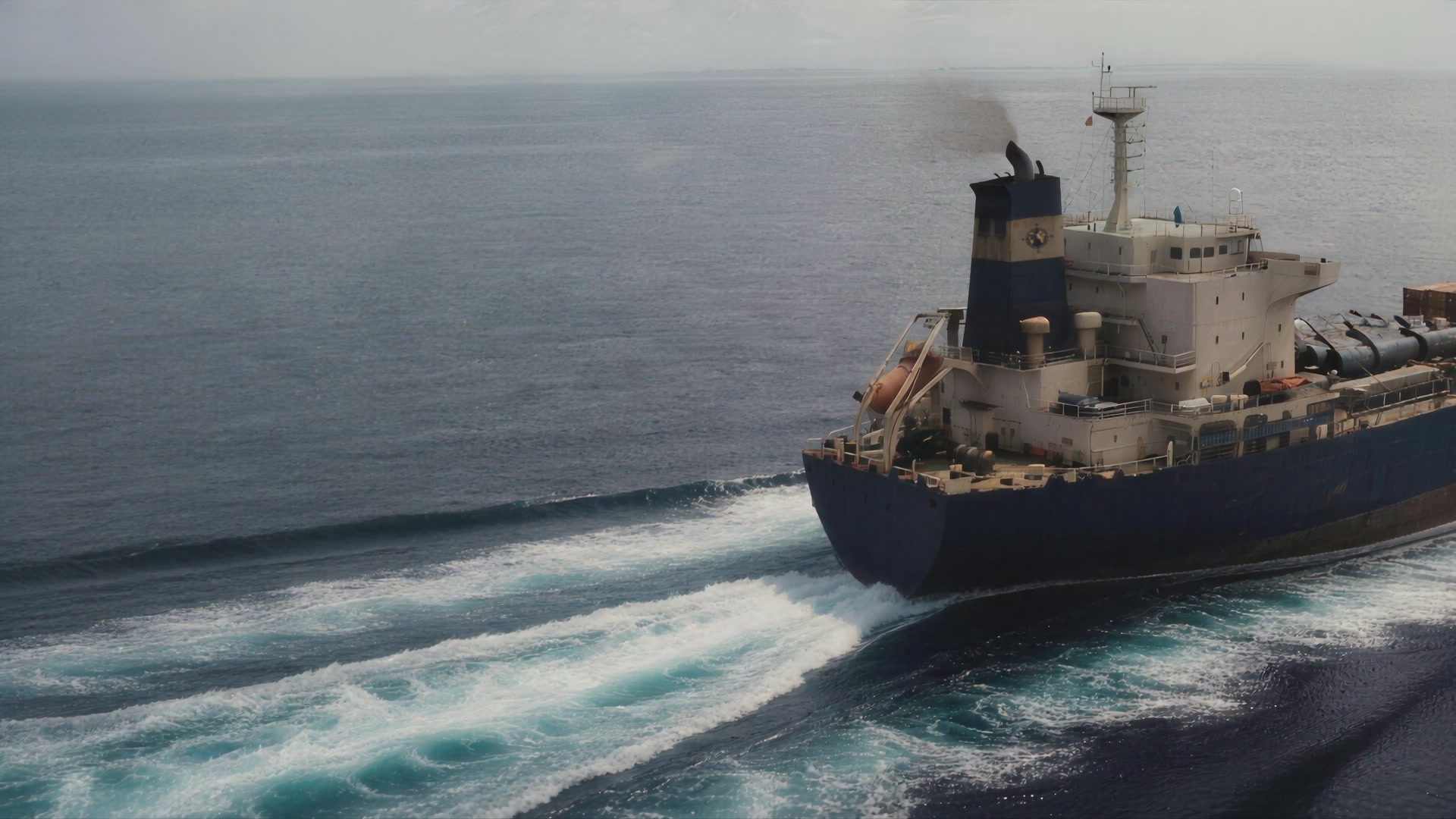 A vessel drawing its wake across open water